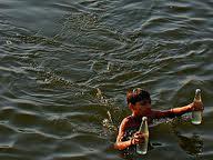 A picture showing a Boy carrying Ganga water by flikre